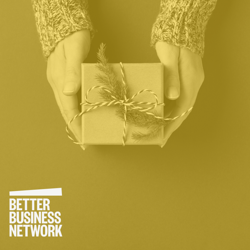 Gift Box held in hand. Better Business Network logo