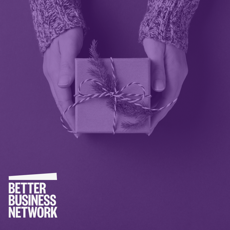 Gift Box held in hand. Better Business Network logo